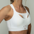 Close-up of Snow on a model, showcasing the breathable mesh panel on the side of the breast and the seamless coverage provided by the moulded cup. 